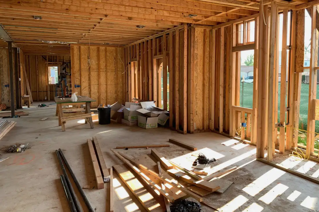 Interior framing with sunlight across the subfloor
