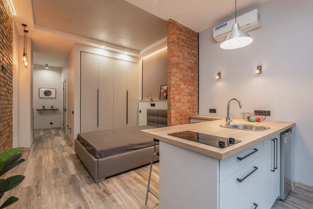 Compact kitchen and sleeping area in a small studio